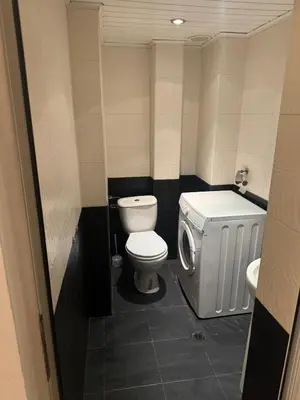 a small bathroom with a toilet and a sink at Апартамент за гости ''ЗДРАВЕ'' in Kyustendil
