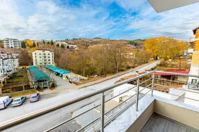 an apartment balcony with a view of a street at Apartment Golden Park in Sandanski