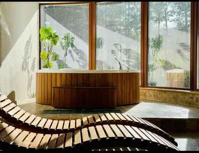 a room with a bench in front of a window at D Villa in Mineralni Bani
