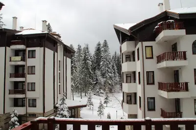 a view of two apartment buildings in the snow at Sunny two bedroom apartment 12 in Tulip , Flora Residence - prime location! in Borovets
