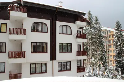 an apartment building with snow on the ground at Sunny two bedroom apartment 12 in Tulip , Flora Residence - prime location! in Borovets