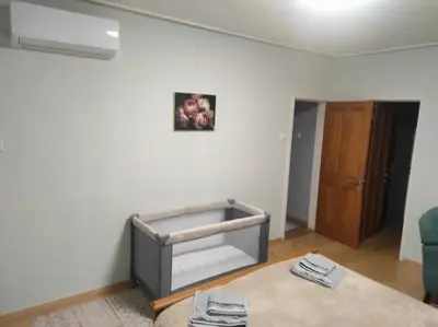 a room with a bed in the corner of a room at Апартамент ГТ in Plovdiv