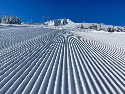 a snow covered field with lines in the snow at Mountain view 1-bedroom apartment few steps from ski piste and Gondola lift in Bansko