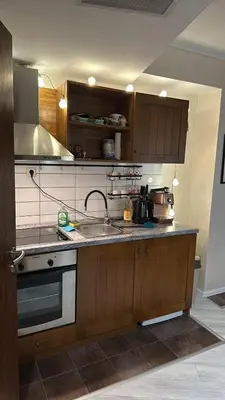 a kitchen with a sink and a stove at English Apartments 2 in Bansko