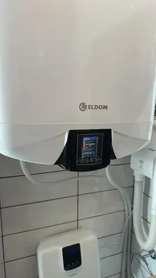 a close up of a machine above a toilet at English Apartments 2 in Bansko