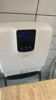 a white printer sitting on top of a table at English Apartments 2 in Bansko