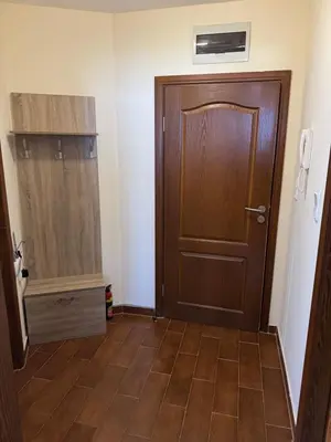 an empty room with a door and a tiled floor at Mimsi Apartment in Pamporovo