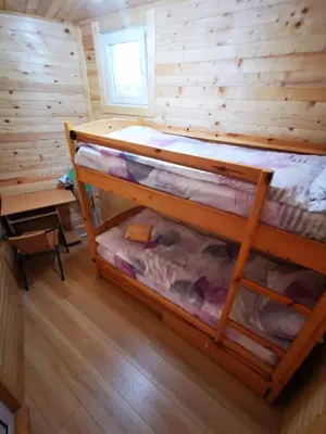a bedroom with two bunk beds in a cabin at Lakeview Estate Chalet in Staro Myasto