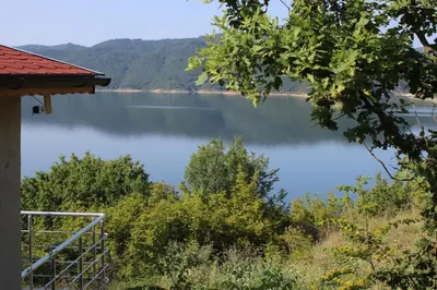 a view of a lake from a house at Lakeview Estate Chalet in Staro Myasto