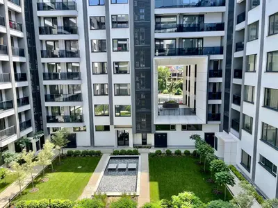 an aerial view of an apartment building with a garden at Apartment with Free Underground Parking by COSHER in Sofia