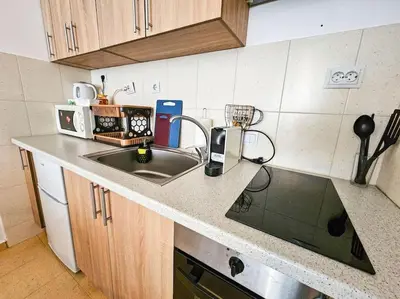 a kitchen with a sink and a counter top at Mountain Dream A8 apartment in Borovets