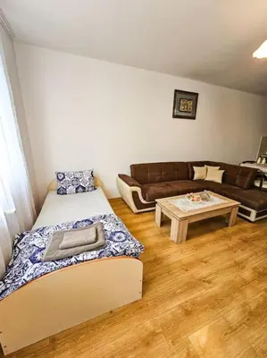 a living room with two beds and a couch at Mountain Dream A8 apartment in Borovets