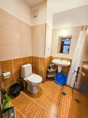 a bathroom with a toilet and a sink at Mountain Dream A8 apartment in Borovets