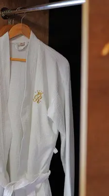 a white wedding dress hanging on a rack at Rich House Velingrad in Velingrad