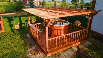 an overhead view of a wooden deck with a water fountain at Къщи за гости 'Веринско' in Verinsko