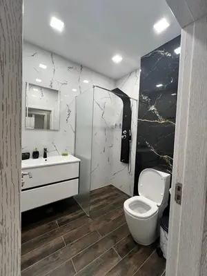 a bathroom with a toilet and a sink at Royalton Résidence in Plovdiv
