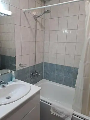a bathroom with a sink and a tub and a shower at FLORA Apartment Hotel STUDIO 411 in Borovets