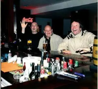 a group of three men standing behind a bar at FLORA Apartment Hotel STUDIO 411 in Borovets