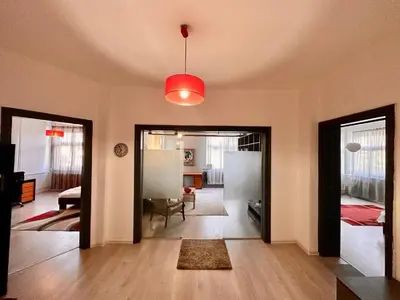 a living room with a door open to a bedroom at Downtown Serenity Apartment in Sofia