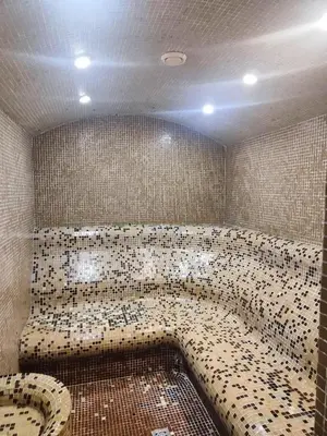 a tiled bathroom with a bath tub in a room at Aspen Resort Studio I306 in Razlog