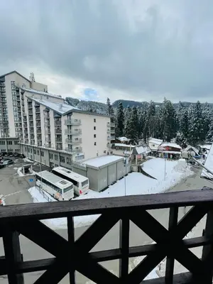 a view of a parking lot with a large building at Snow Forest in Borovets