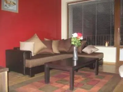 a living room with a couch and a coffee table at 27 Monastery in Bansko