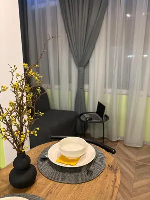 a table with a bowl and a plate on it at Inspiration Nook in Sofia
