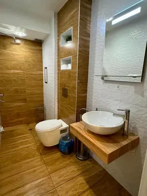 a bathroom with a sink and a toilet at New Bulgarian Apartment in Sofia