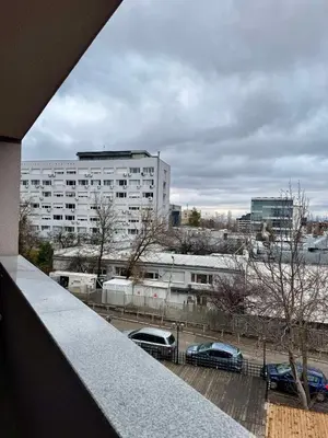a view from a balcony of a building with cars at New Bulgarian Apartment in Sofia