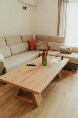 a coffee table in a living room with a couch at Apartment Aria 2 in Velingrad