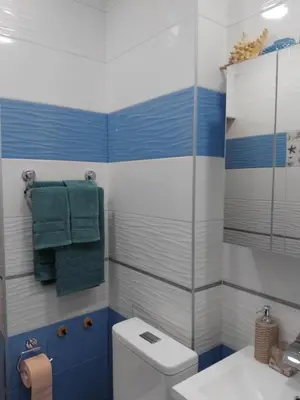 a bathroom with a toilet and a glass shower at Art Apart - Top Center in Sofia