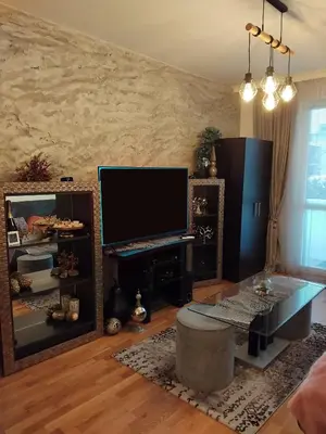 a living room with a flat screen tv on a wall at Art Apart - Top Center in Sofia