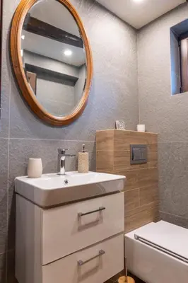 a bathroom with a sink and a mirror at Гусу Баба in Kostenets Village