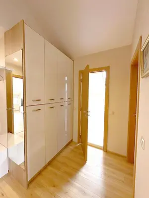 a kitchen with white cabinets and a mirror at Old City Views - Luxury 2BDR Apt & Free Parking in Sofia