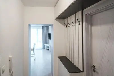 a room with a door and a hallway with a desk at Apartment Aria 3 in Velingrad