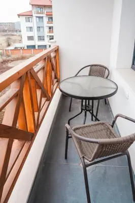 a table and two chairs on a balcony at Apartment Aria 3 in Velingrad