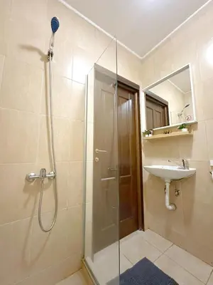 a bathroom with a shower and a sink at Aurora Abode - Top Center 1 BDR Fast Wi-fi in Sofia