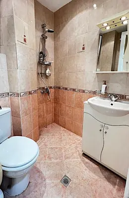 a bathroom with a toilet and a sink at Great location in the Center in Sofia