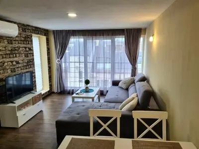 a living room with a couch and a tv at Fast Wi-Fi, Kitchen, In Sofia in Sofia