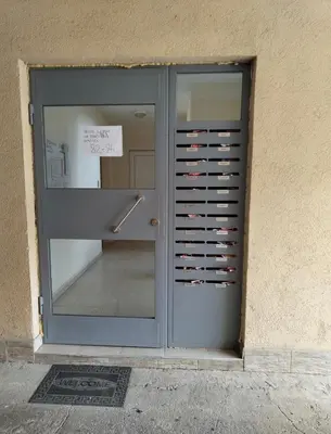 a door to a building with a sign in it at Fast Wi-Fi, Kitchen, In Sofia in Sofia