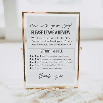 a sign that says please leave leave a review at GONDOLA APARTMENTS BANSKO - SUVOROV VIP Complex in Bansko