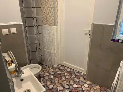 a bathroom with a shower and a toilet and a sink at Southern Hill in Sofia