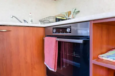 a kitchen with a sink and an oven with towels at Best Location in Sofia Center in Sofia