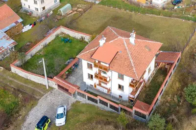an aerial view of a house with a red roof at Cozy Luxurious Apartment Next to Borovets and Rila mountain in Govedartsi