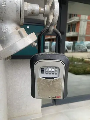 a padlock is attached to a parking meter at 5 min from the Airport in Sofia