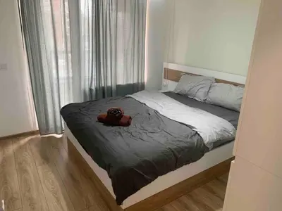 a bedroom with a bed with a teddy bear on it at 5 min from the Airport in Sofia