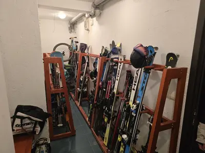 a bunch of skis are lined up against a wall at La Mont Apartment Bansko in Bansko