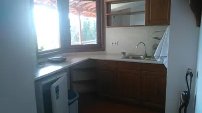 a kitchen with a sink and a window at Tora Bora Guest House in Pancharevo