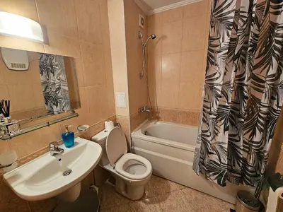a bathroom with a sink and a toilet and a tub at Viva 4-A-23 Apartment ski to the door complex Grand Monastery Pamporovo in Pamporovo
