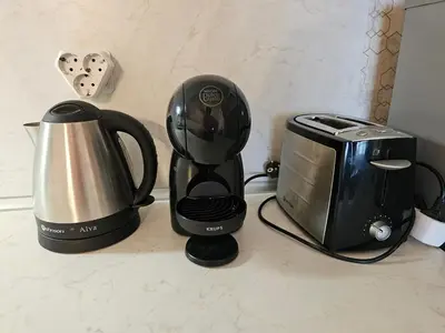 a coffee maker and a toaster on a counter at Viva 4-A-23 Apartment ski to the door complex Grand Monastery Pamporovo in Pamporovo
